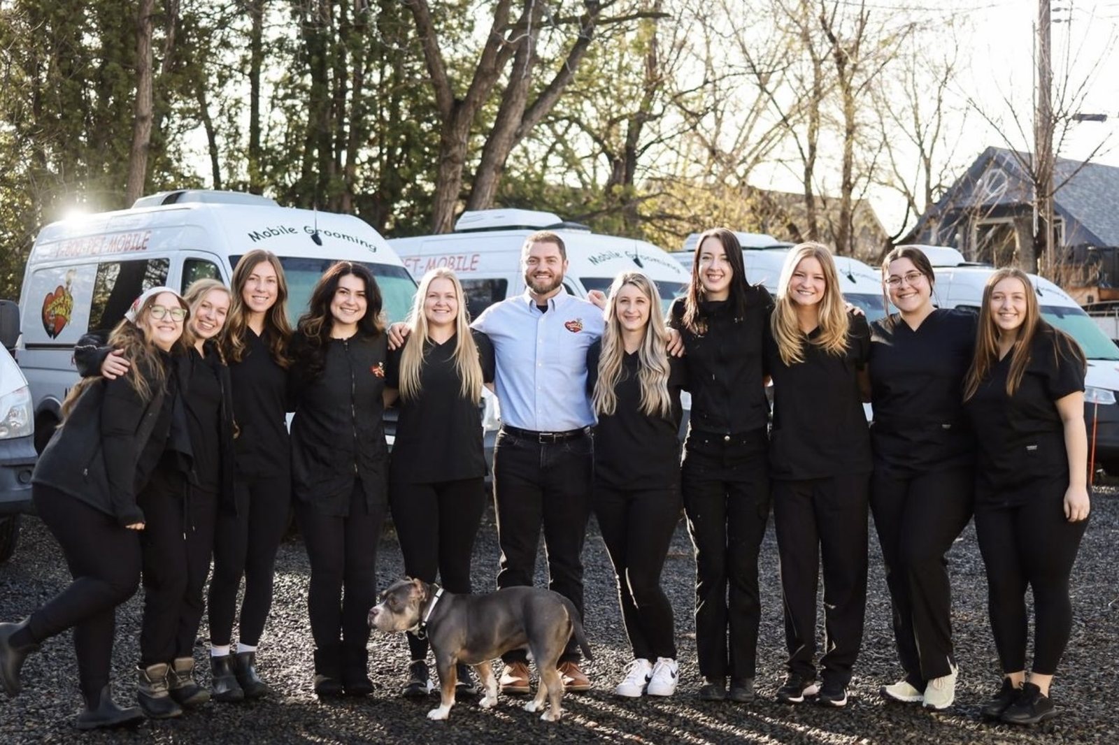 Harry Maalouf with his mobile grooming team in front of the vans